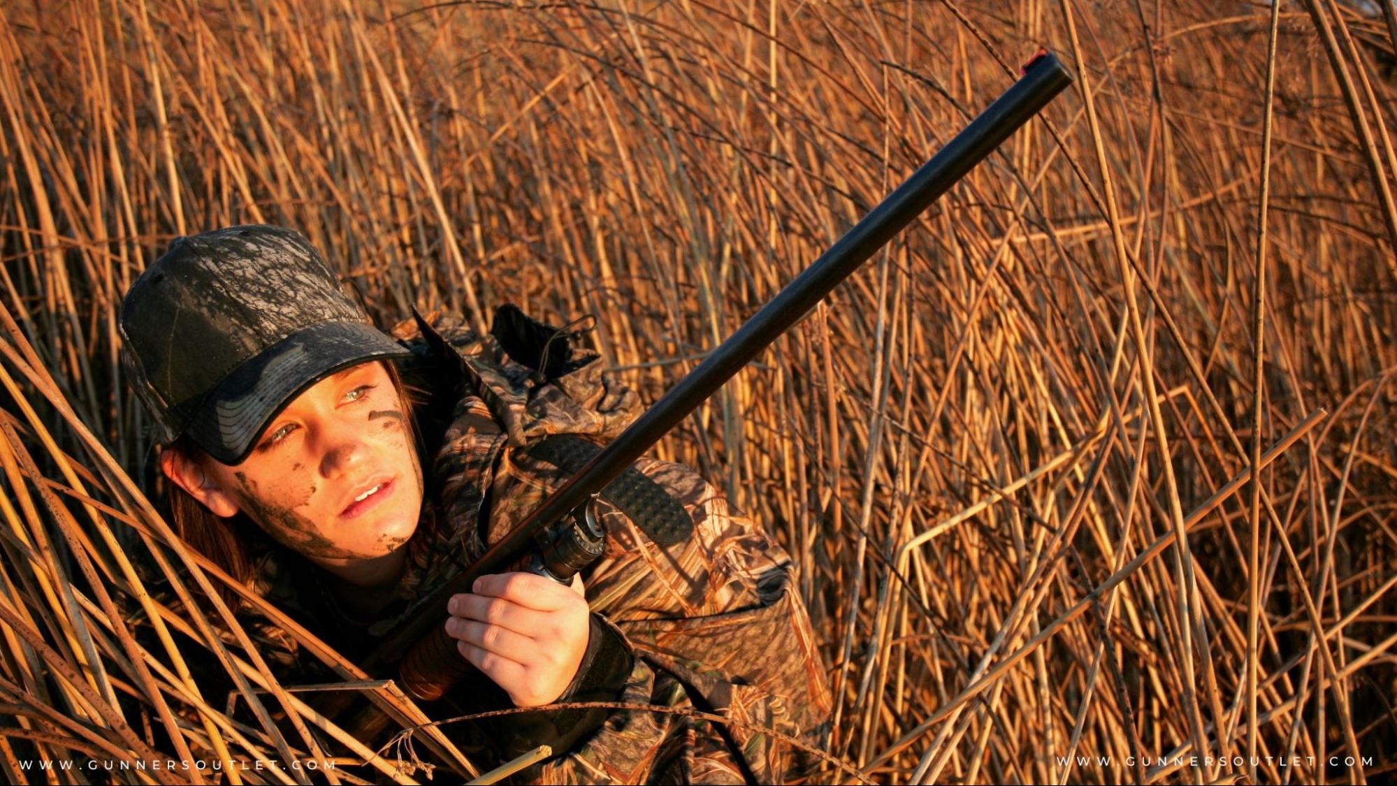 woman hunting in tall grass